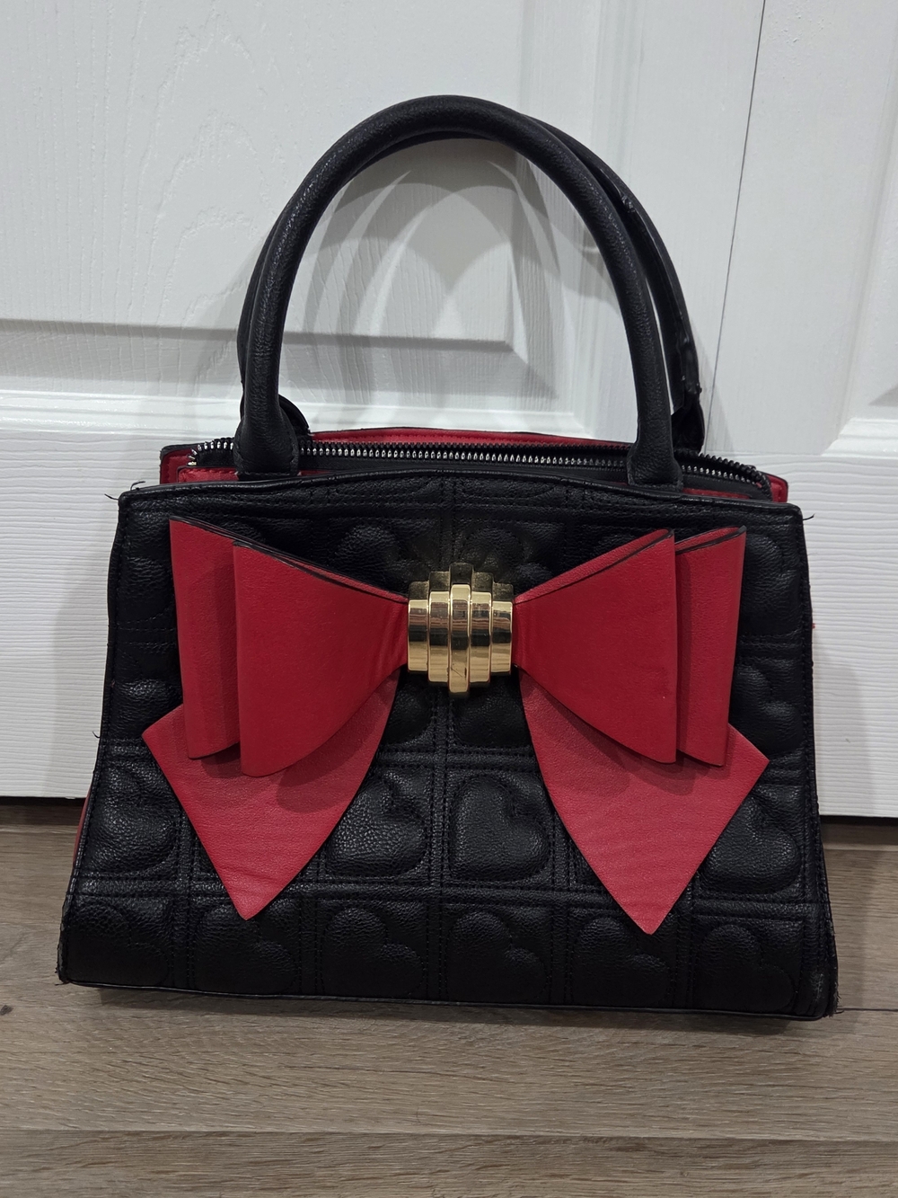 Betsy Johnson Black Handbag with Red Bow Accent